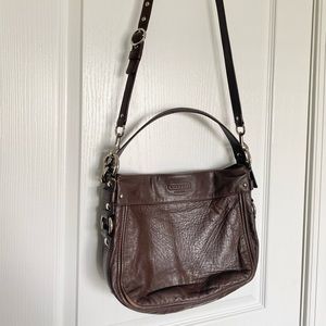 Beautiful Coach leather bag with a blue fabric interior.